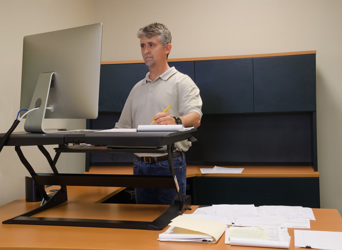 man working on a stand up desk